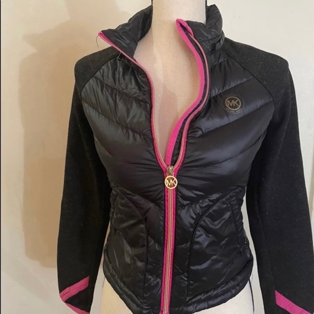 Girl MK jacket great worn condition with a small hole a pictured.